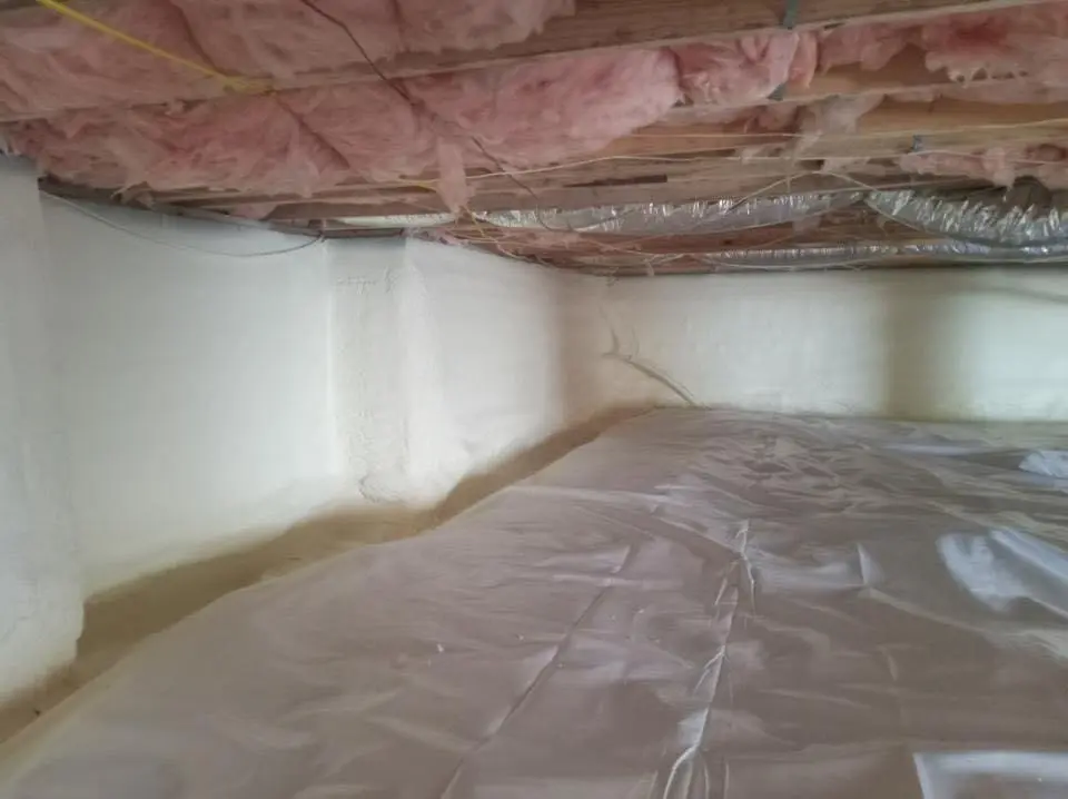 Crawl space encapsulation with closed-cell spray foam for Commercial Roof Restoration in Providence